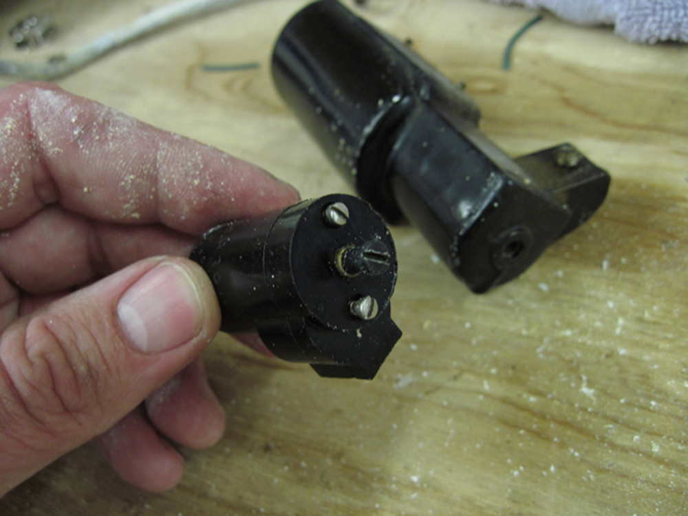 A closeup of the lampholder showing the removal screws.